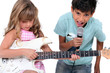 children singing and playing music