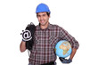 Electrician holding at sign and globe