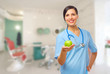 Young doctor with green apple