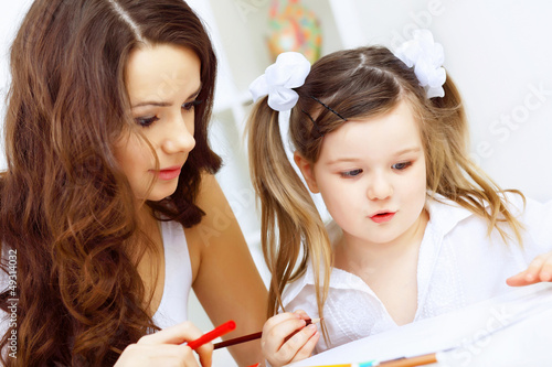 Photo: Mother and daughter studying Mother and daughter studying