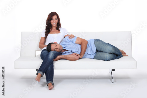 Photo: Sleeping man with his head on his girlfriend's lap Sleeping man with his head on his girlfriend's lap