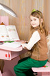 Smiling young girl working at her desk