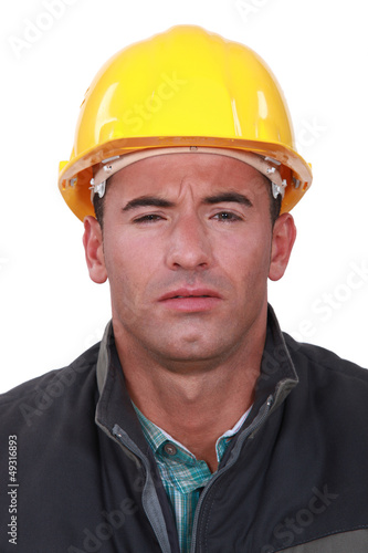 Photo: A construction worker with a weird expression. A construction worker with a weird expression.