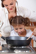 Mother cooking with daughter