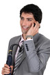 A polished businessman talking on his mobile phone