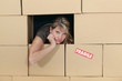 Woman surrounded by cardboard