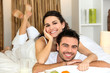 Couple laying in bed together