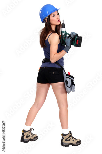 Photo: Sexy worker blowing on her electric screwdriver Sexy worker blowing on her electric screwdriver