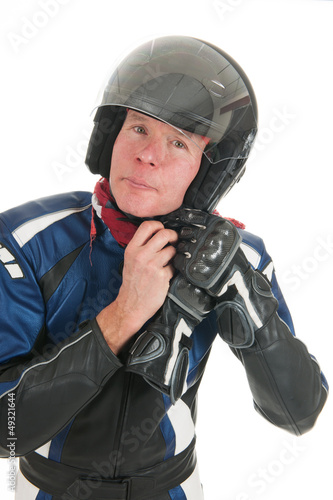 Photo: Portrait motor biker putting on his helmet Portrait motor biker putting on his helmet