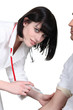 Doctor injecting a male patient