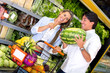 Couple buying fresh fruits