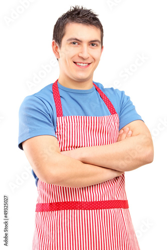 Photo: A portrait of a young male wearing apron and posing A portrait of a young male wearing apron and posing