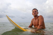 Photo: Water sport: man with surf board in ocean Water sport: man with surf board in ocean