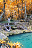 Autumn Deep forest waterfall (Erawan Waterfall) in Thailand