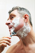 Image of mature man shaving