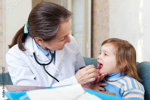 Photo: Doctor looks mouth of child Doctor looks mouth of child