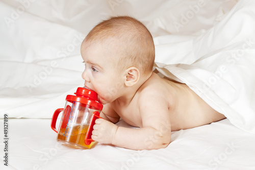 Photo: Little girl with baby bottle Little girl with baby bottle