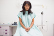 Thoughtful patient sitting on a table