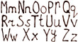 Big and small letters of the alphabet made from chocolate syrup