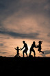 Family having fun at sunset in park