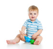 Baby  boy playing with musical toys. Isolated on white backgroun
