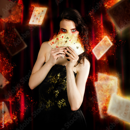 Photo: Tarot Magician Holding Magic Fire Cards Of Fate Tarot Magician Holding Magic Fire Cards Of Fate