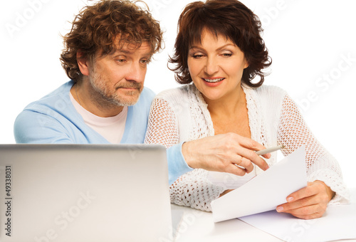 Photo: Old couple discussing some paper Old couple discussing some paper