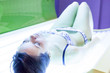 Slim woman in a solarium