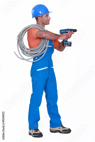 Photo: Electrician with a drill Electrician with a drill
