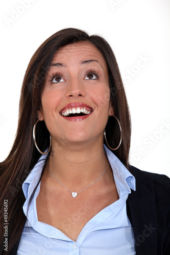 Photo: business woman laughing and looking up business woman laughing and looking up