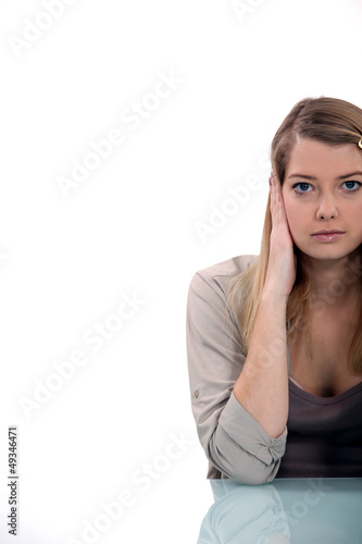 Photo: Holding her hands over ears Holding her hands over ears