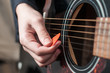 Female hand playing acoustic guitar.guitar play.