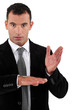 Businessman doing a magic trick with money