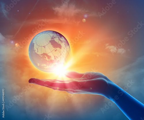 Photo: Image of earth planet on hand Image of earth planet on hand