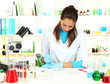 Young scientist with Petri dish in  laboratory.