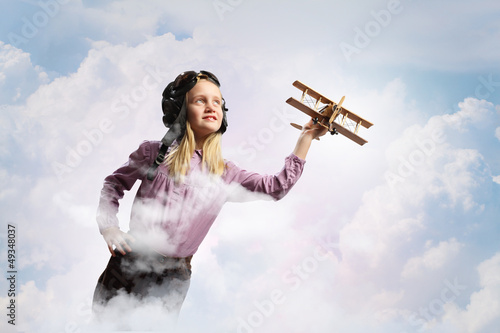 Photo: Little girl in pilot's hat Little girl in pilot's hat