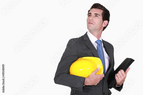 Photo: Architect with helmet in hand Architect with helmet in hand