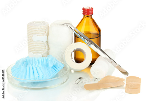 Photo: First aid kit for bandaging isolated on white First aid kit for bandaging isolated on white