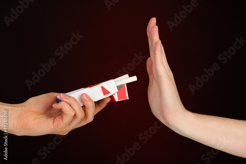 Photo: Concept: stop smoking, on black background Concept: stop smoking, on black background