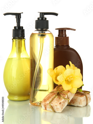 Photo: Liquid and hand-made soaps isolated on white Liquid and hand-made soaps isolated on white
