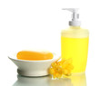 Bottle and soap-dish with soap isolated on white