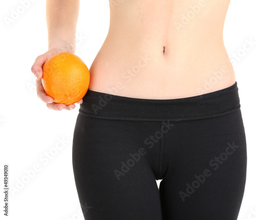Photo: Beautiful female figure with orange isolated on white Beautiful female figure with orange isolated on white