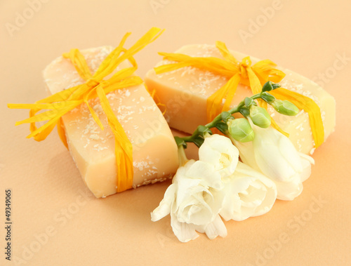 Photo: Natural handmade soap, on beige background Natural handmade soap, on beige background