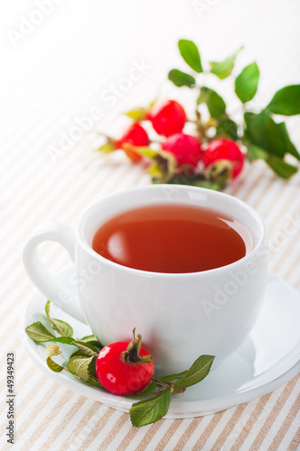 Photo: Fresh rose hip and drink a cup of rose hips Fresh rose hip and drink a cup of rose hips
