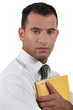 Businessman protective of document