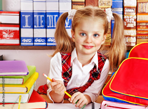 Photo: Child with stack book. Child with stack book.