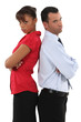 couple standing back to back after quarrel