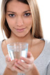 Foto: Young woman with a glass of water Young woman with a glass of water
