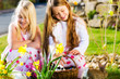 Children on Easter egg hunt with bunny
