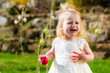 Girl on Easter egg hunt with eggs